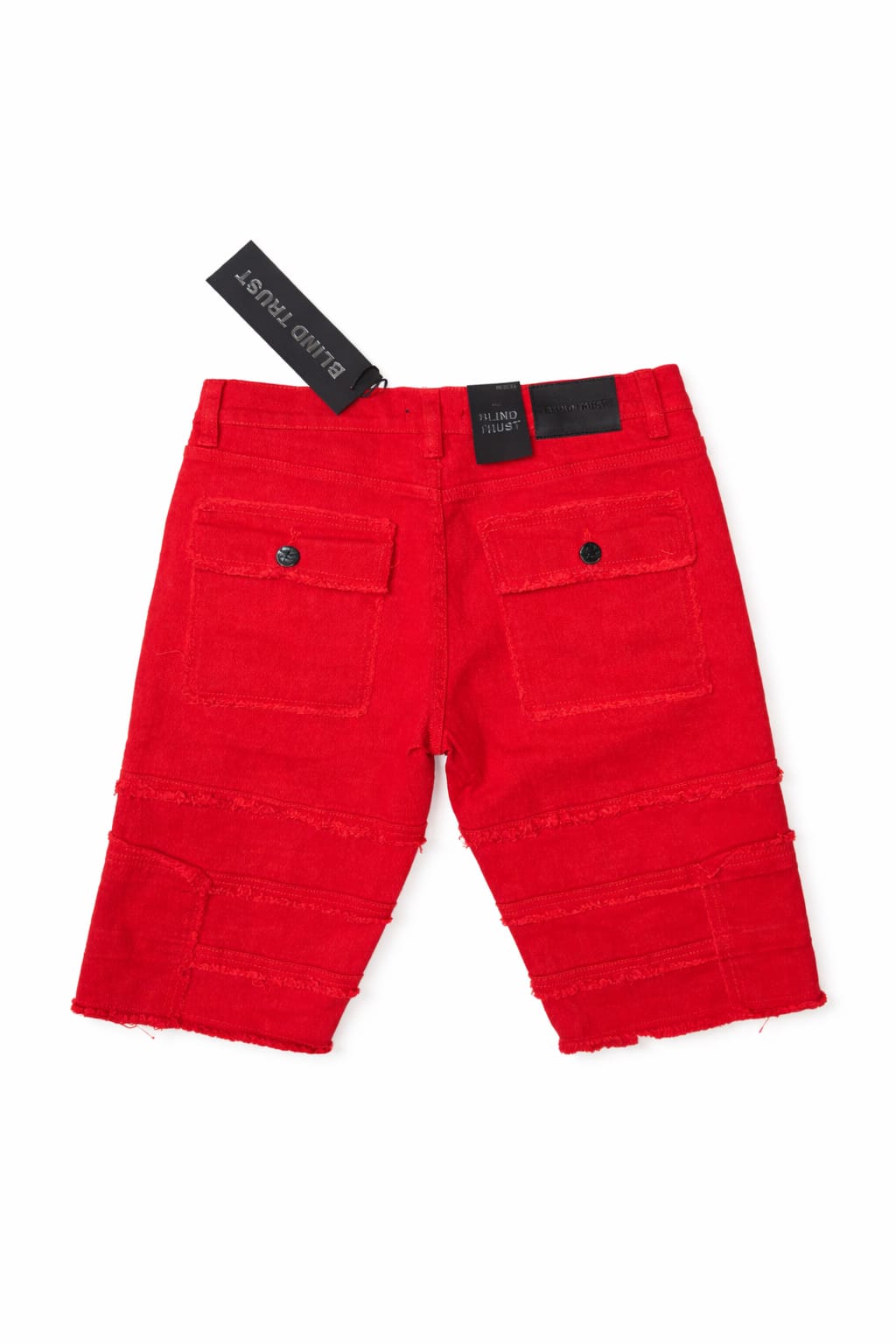 Red pants with a tag on a white background