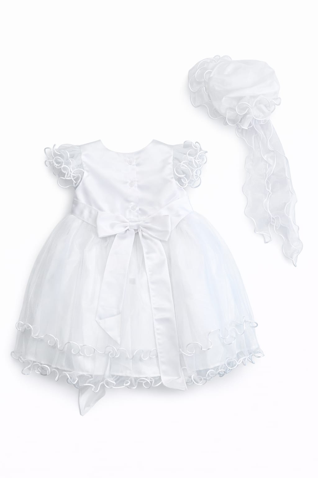 White baby dress with lace details and matching bonnet on a white background