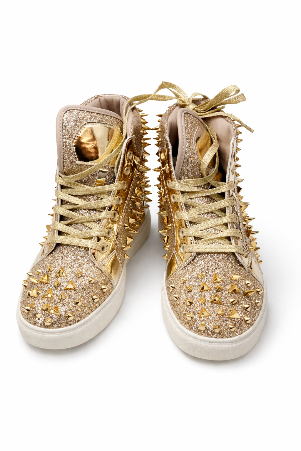 Pair of high-top sneakers with gold spikes and laces on a white background