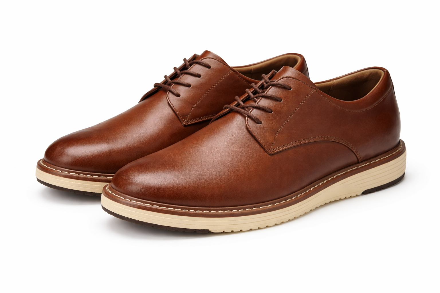 Pair of brown leather shoes on a white background