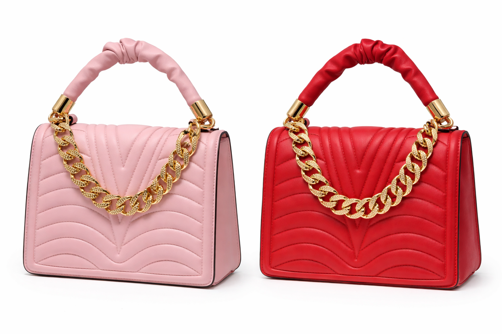 Pink and red handbags with gold chains on a white background