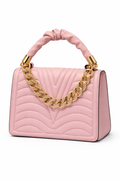 Pink handbag with gold chain handle on a white background