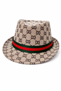 Beige monogram fedora hat with red and green band detail on white background.